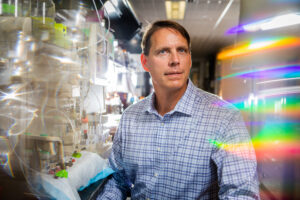 Man looking with question in laboratory.